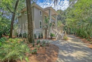 a house with trees and plants in front of it at 217 Glen Abbey in Kiawah Island