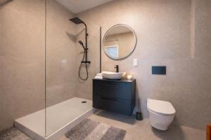 a bathroom with a sink and a toilet and a shower at Modern 2023 apartment in Kutno +11 photos