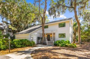 a white house with trees in front of it at 2455 The Bent Twig in Seabrook Island