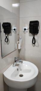 a bathroom with a sink and a mirror at Vadamar Apartment in Sisian