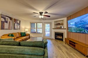 a living room with a couch and a fireplace at Alpine Retreat in Helen