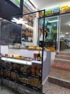 a food stand with bread and pastries on display at Haadrin Fellini Home in Haad Rin