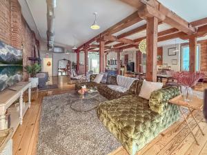 a living room with a couch and a table at Loft 40 in Cleveland