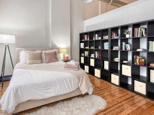 a bedroom with a large black book shelf at Loft 40 in Cleveland