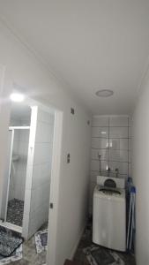 a small bathroom with a toilet and a shower at Departamento Independiente a 2 cuadras de Costanera in Punta Arenas +8 photos
