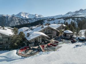 an aerial view of a house in the snow at Hotel Le K2 Altitude in Courchevel