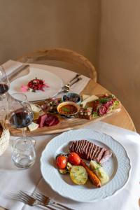 a table with a plate of food on a table at Terra dei Bisonti in Panicale