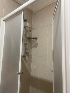 a shower with a glass door in a bathroom at Hotel Center 3 in Rome +51 photos