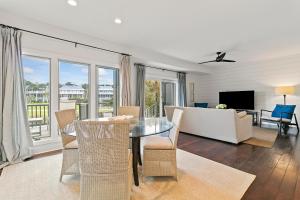 a living room with a table and a couch at 4956 Green Dolphin in Kiawah Island