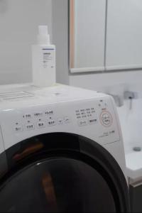 a close up of a washing machine in a kitchen at Tokyo stay 365 in Tokyo