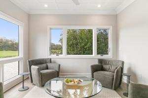 a living room with two chairs and a glass table at 4910 Green Dolphin in Kiawah Island