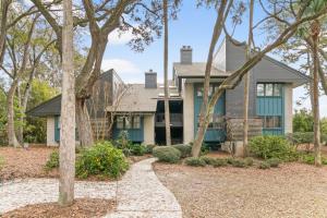 a house with trees in front of it at 4910 Green Dolphin in Kiawah Island