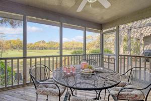 a patio with a table and chairs on a balcony at 273 Summer Tanager in Kiawah Island