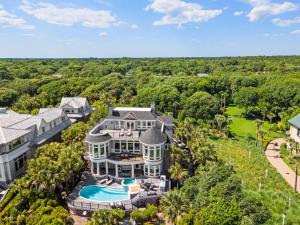 an aerial view of a mansion with a swimming pool at 38 Surfsong in Kiawah Island