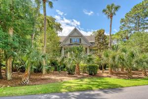 a house with palm trees in front of it at 68 New Settlement in Kiawah Island