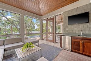 a living room with a couch and a tv at 68 New Settlement in Kiawah Island