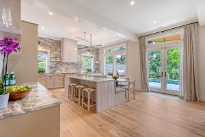 a kitchen with a large island with a counter top at 135 Halona Ln in Kiawah Island
