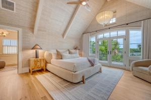 a living room with a bed and a couch at 135 Halona Ln in Kiawah Island +76 photos