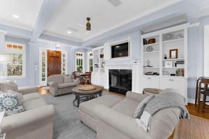 a living room with a couch and a fireplace at 711 Glossy Ibis in Kiawah Island