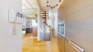 a large kitchen with a stove and a refrigerator at Casa Nina in Gabicce Mare