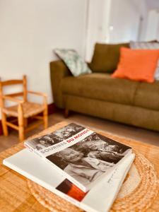 a magazine sitting on a table in a living room at Grande maison de ville MALO LEONE 250m2 pour 15 personnes proche du Puy du Fou in Mauléon