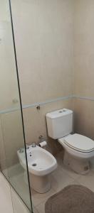 a bathroom with a toilet and a sink at Departamento duplex in Concordia