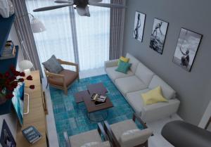 a living room with a white couch and a table at Luxora Hotel Lodwar in Lodwar +6 photos