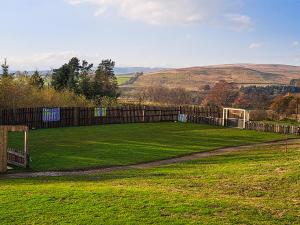a field with a fence and a soccer ball at Jupiter 1 - Uk50471 in Greenhaugh