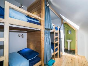 a bunk bed with blue pillows in a room at Jupiter 1 - Uk50471 in Greenhaugh