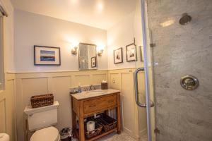 a bathroom with a sink and a shower at Coates By Hauserman Rentals in Tahoe City +12 photos