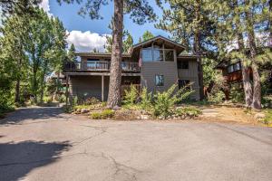 a house with a driveway in front of it at Coates By Hauserman Rentals in Tahoe City