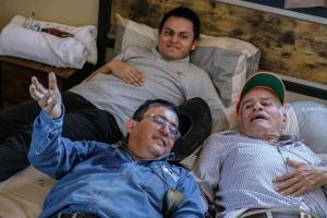 a group of three men laying in beds at Cuanax hotel boutique tematico - Mineral de Pozos in Mineral de Pozos +45 photos