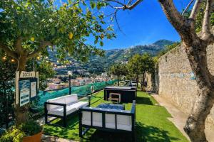 a garden with a view of the city at Eden Holiday in Minori