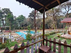 a view of the pool from the balcony of a resort at victory farms in Nadora
