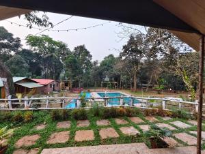a view of a swimming pool at a resort at victory farms in Nadora +8 photos