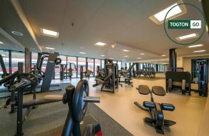 a gym with treadmills and cardio equipment in a building at Nice Växjö City Stay In Arenastaden Vida Arena in Växjö