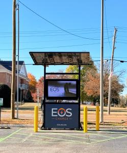 a bus stop with an evos climate sign on it at Milan inn & Suites in Milan