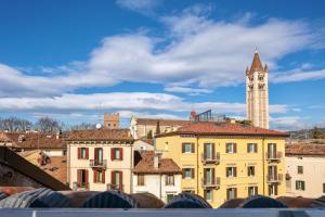 a view of a city with a clock tower at Zeno Suites in Verona