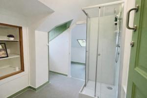 a bathroom with a shower with a glass door at Happy Holiday Sintra Guesthouse & Breakfast in Sintra +78 photos