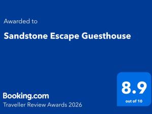 a blue sign that escape questionnaire with a blue box at Sandstone Escape Guesthouse in Ladybrand
