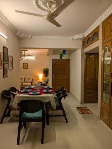 a dining room with a table and chairs at 3 ac Bedroom in Dhaka