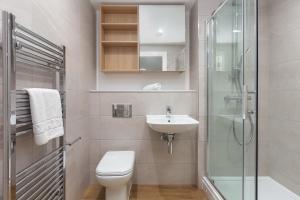 a bathroom with a toilet and a sink and a shower at Orchard by UTDM in Bristol +33 photos