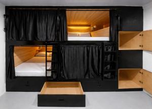 a group of bunk beds in a room at Islanders Hostel Siquijor in San Juan