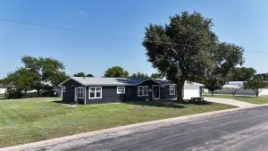 a black house on the side of a road at High Plains Hideout 3 bedrooms 2 Baths in WaKeeney
