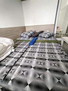 two beds in a room with a bed at City Centre Suits 3 in Varna City