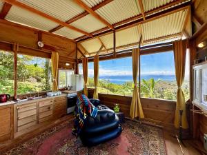 a large kitchen with a view of the ocean at Mountain Chalet with Awesome Sea View in Loma Partida