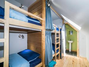 a bunk bed with blue pillows in a room at Saturn 2 - Uk50472 in Greenhaugh