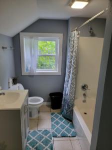 a bathroom with a sink toilet and a window at 5 minutes from Garrison Ave in Fort Smith +19 photos