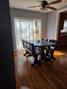 a dining room with a table and two chairs at 5 minutes from Garrison Ave in Fort Smith