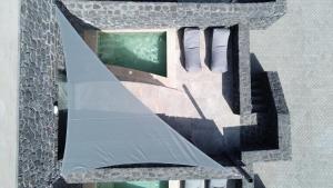 an overhead view of a building with a window at Santorini Cave Luxury Suites in Fira